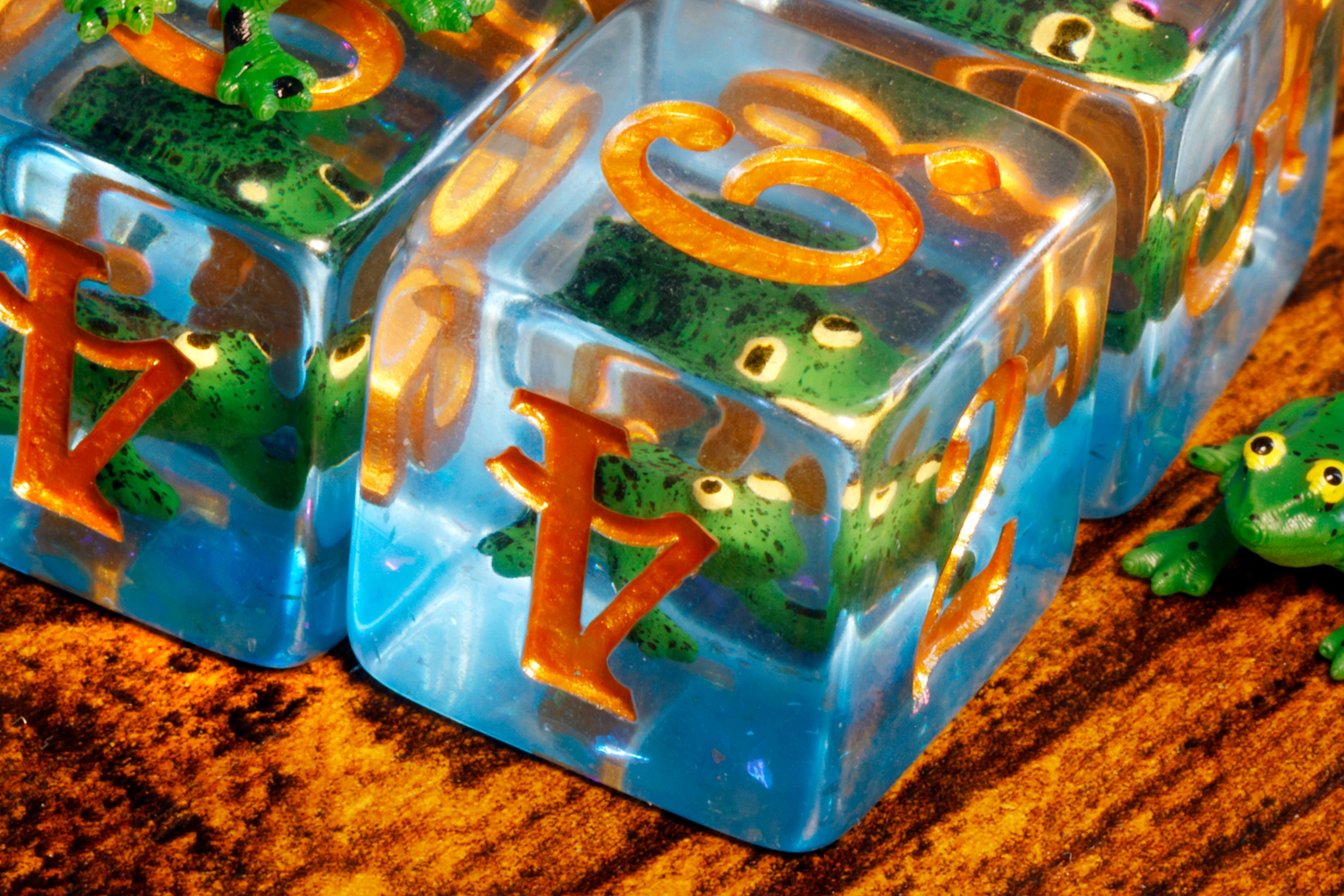 a close up of two plastic dices on a table