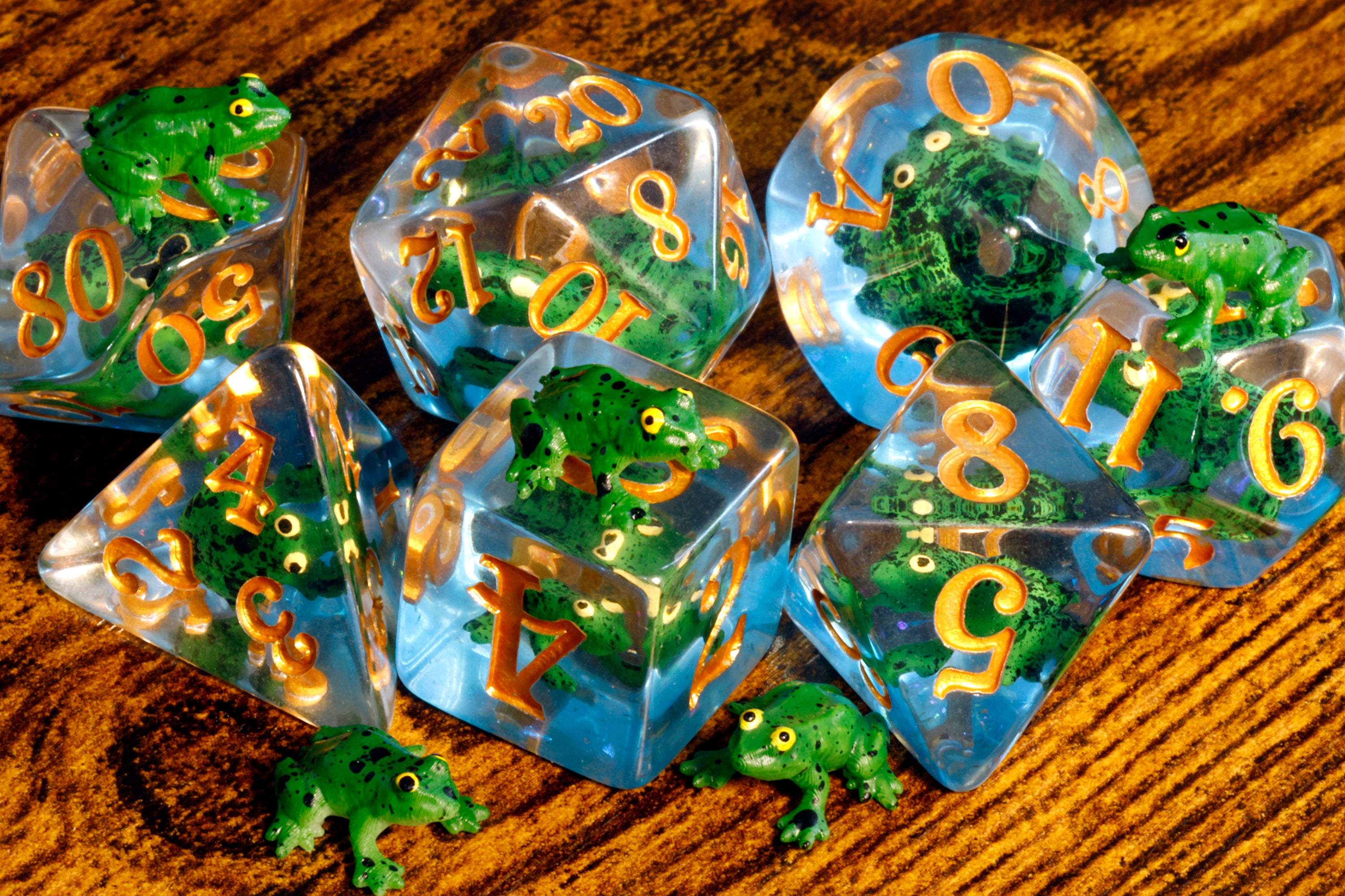 a group of clear dices with gold numbers and broccoli