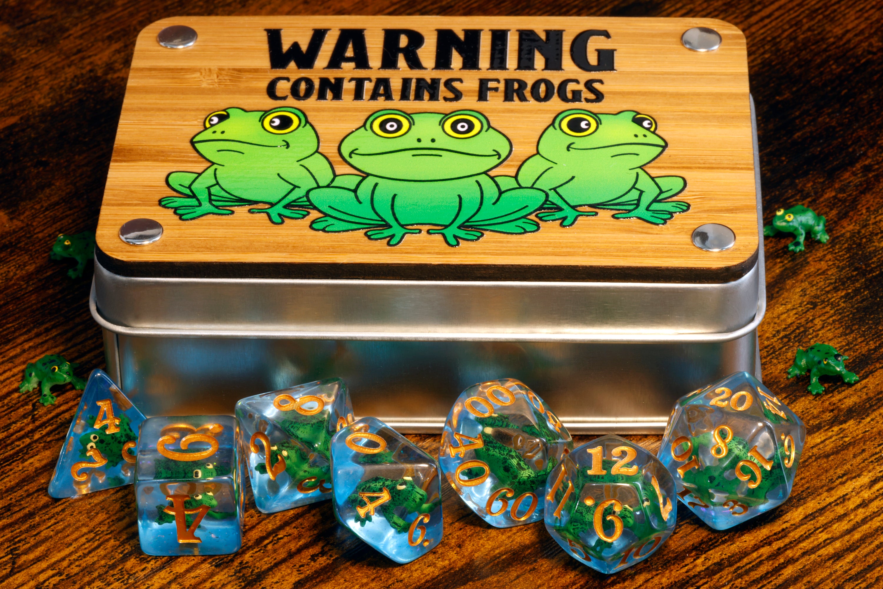 a metal tin with dices sitting on top of a wooden table