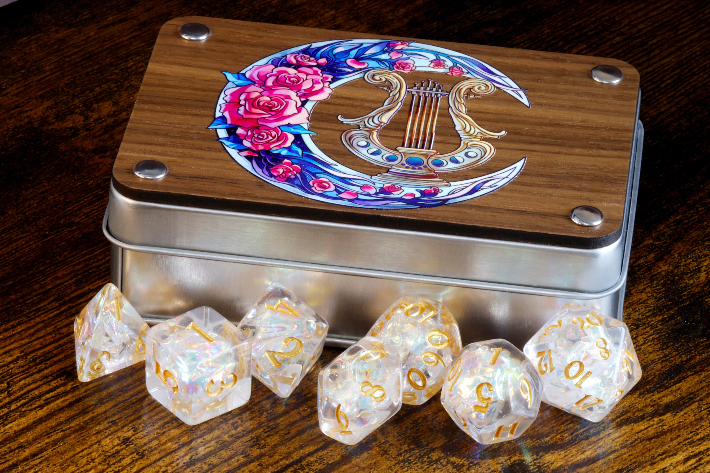 a metal tin with dice and some flowers on it