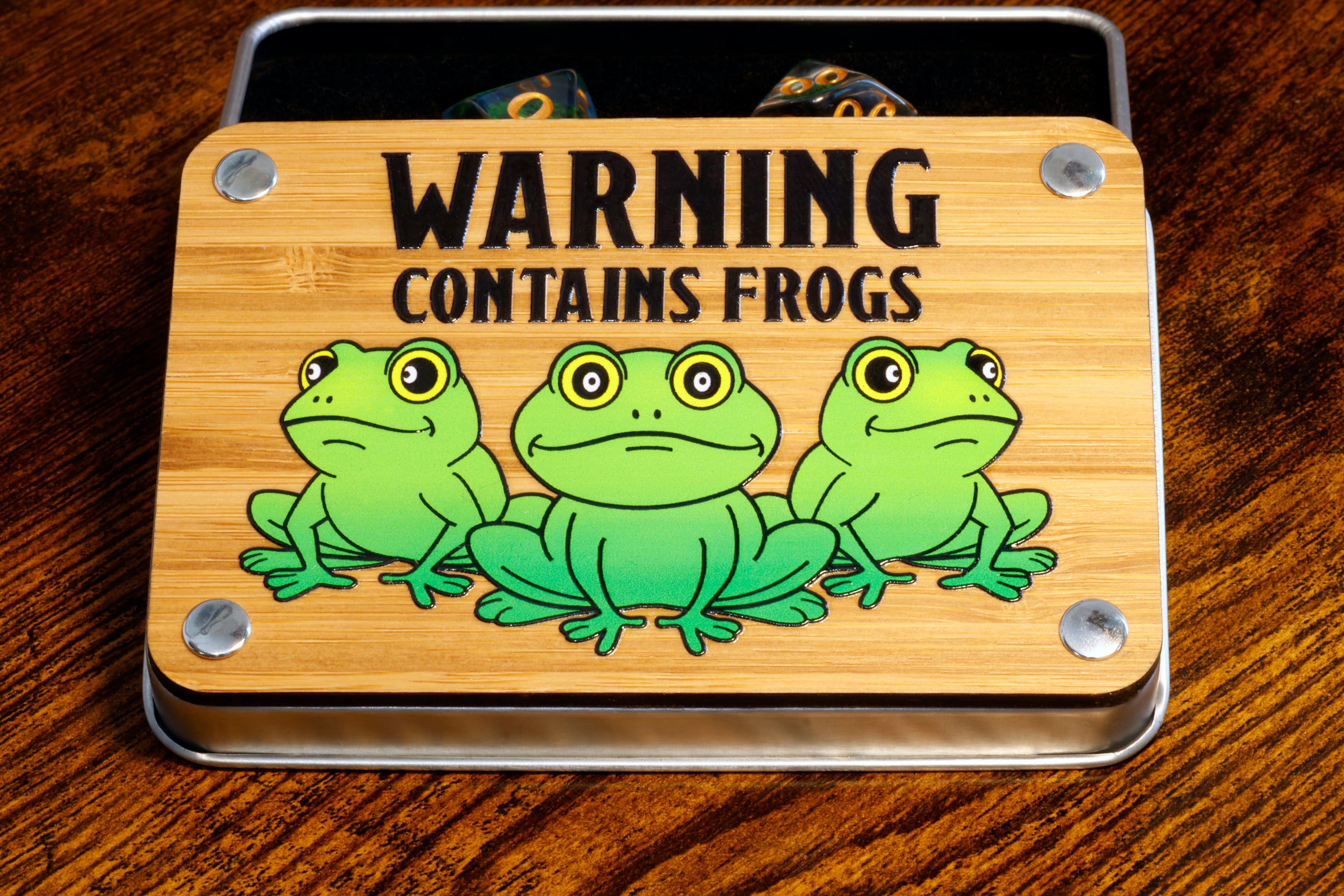 a wooden sign with three frogs on it