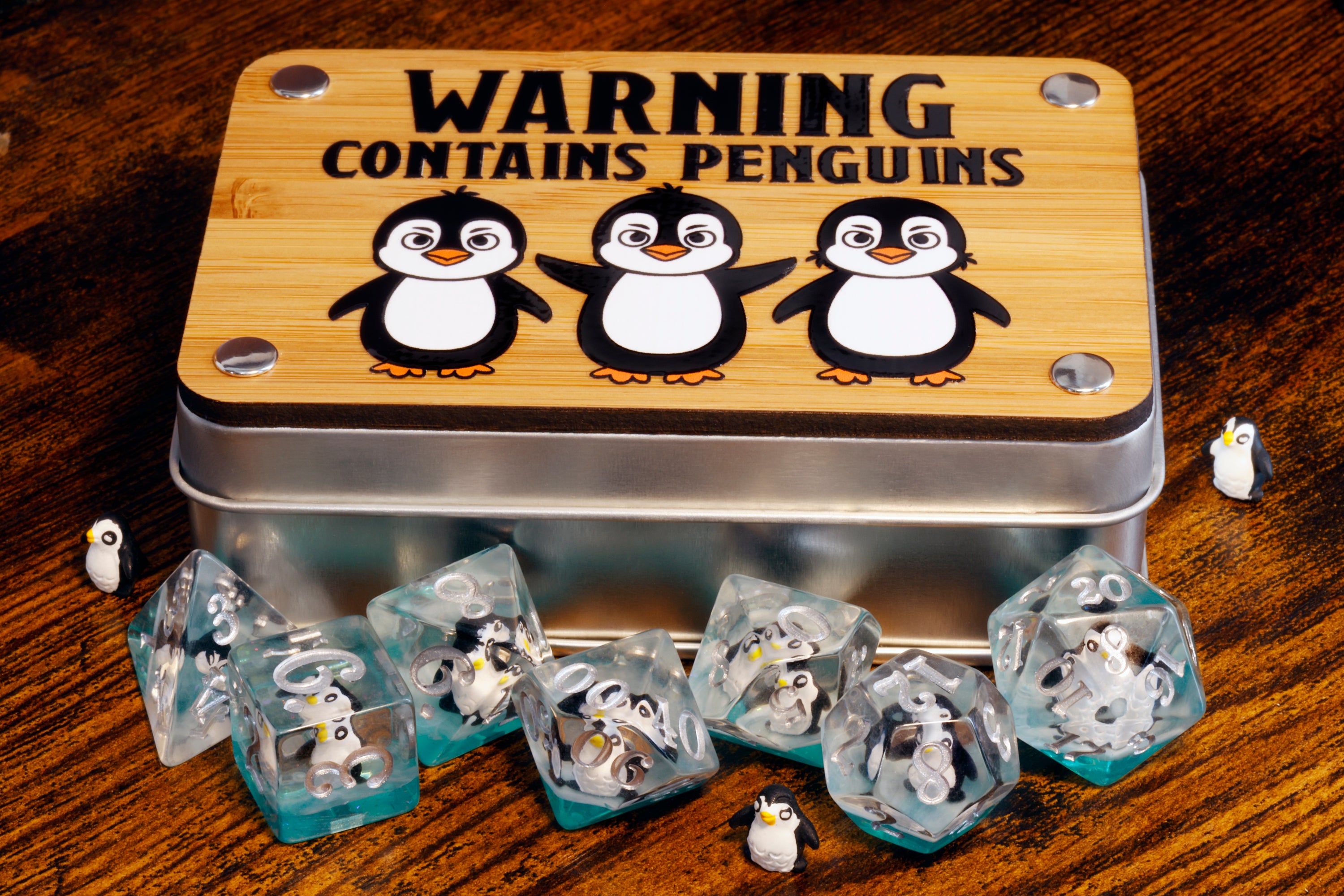 a tin with penguins on it sitting on a table