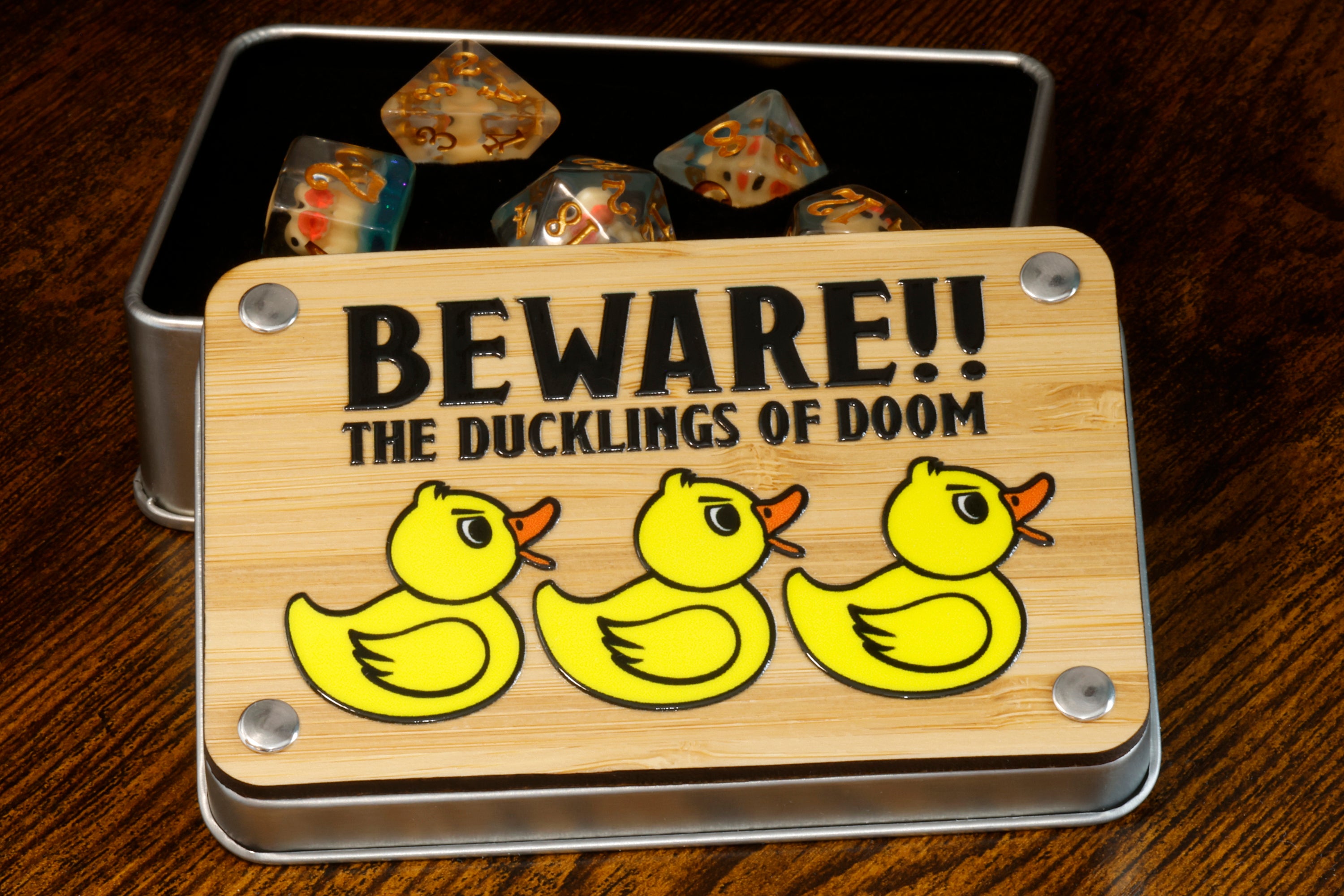 a metal tin with a wooden sign that says beware the ducks of room