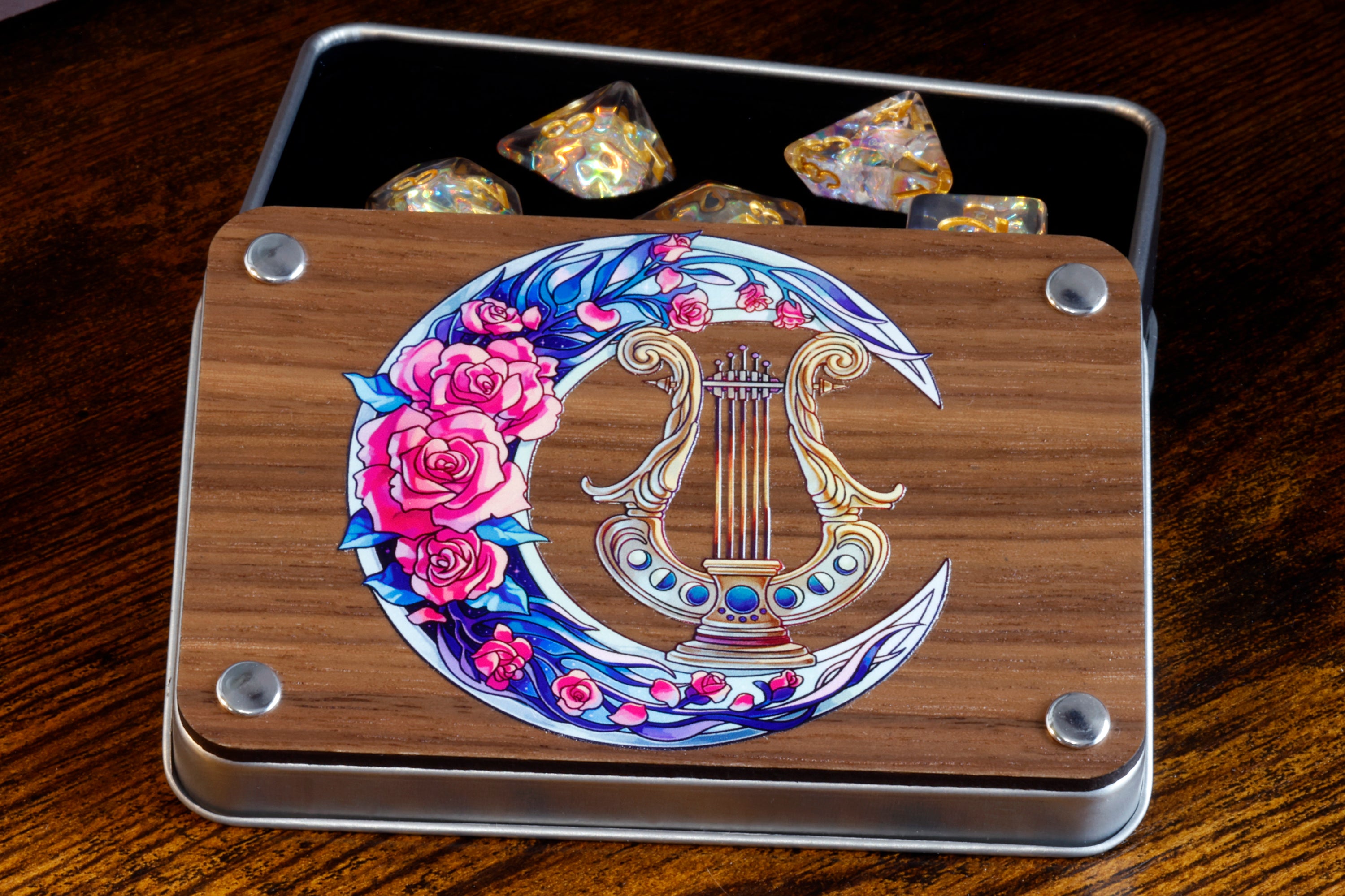 a wooden box with a design of a harp and roses on it