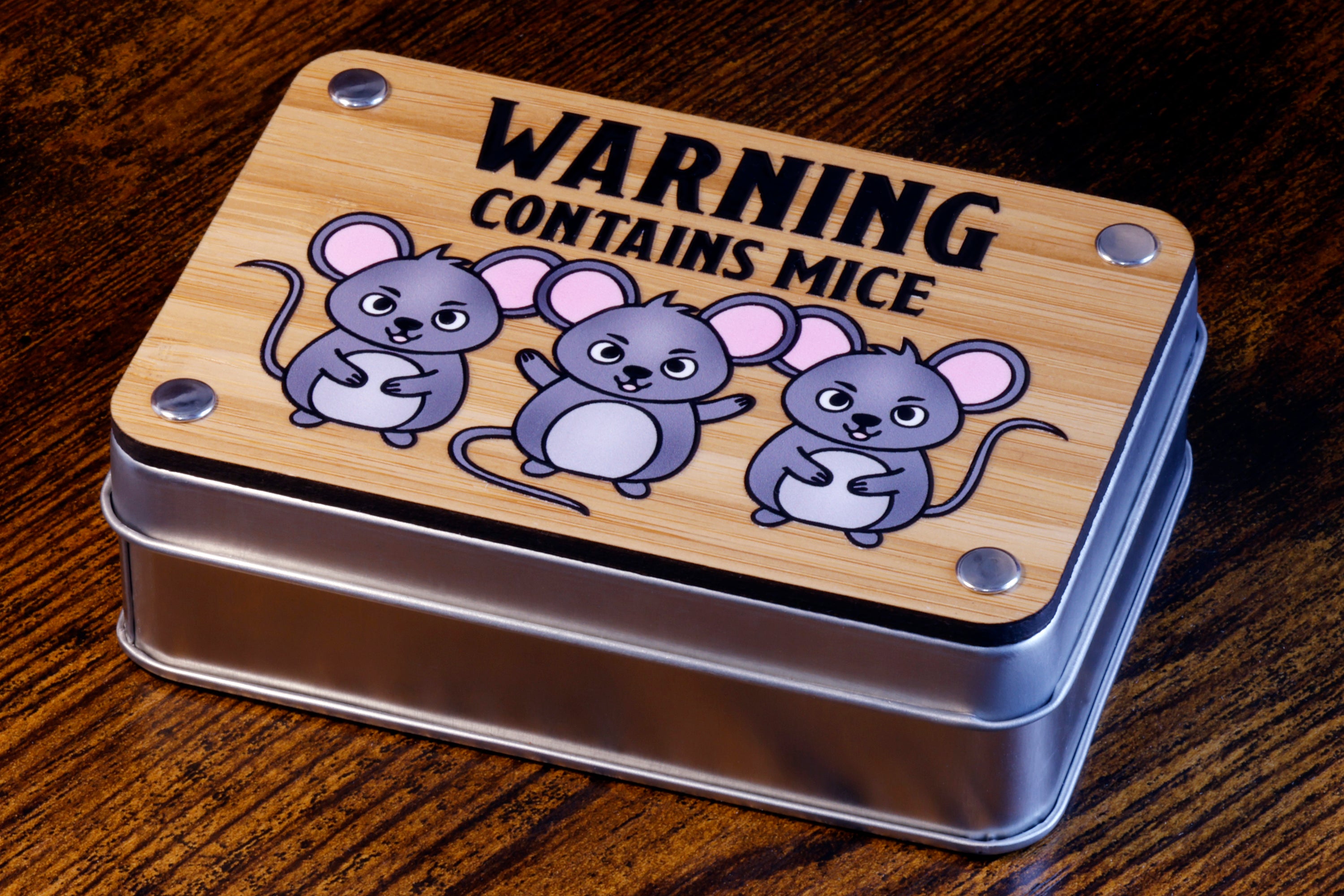 a tin with a picture of three mice on it